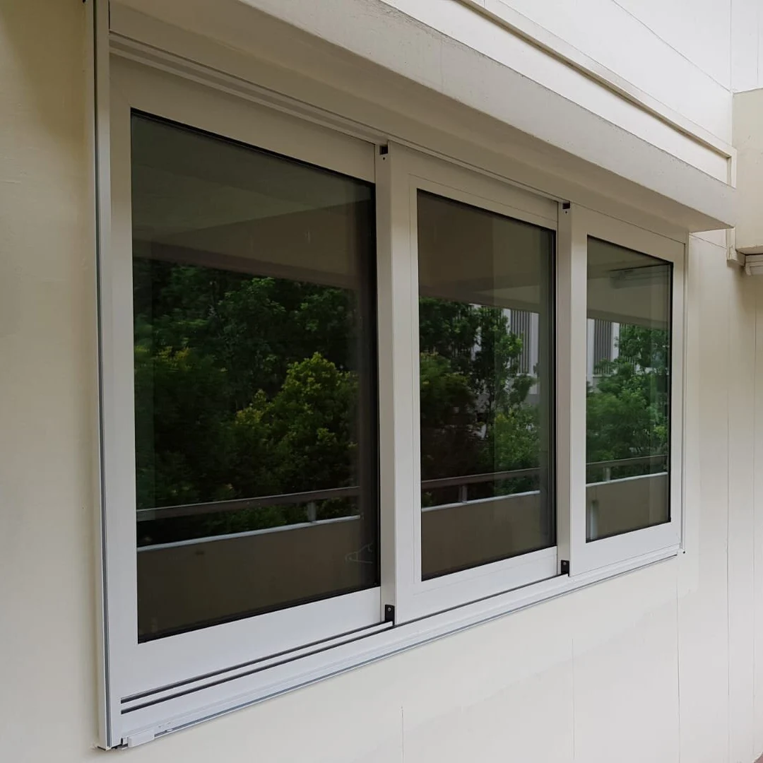 Three-panel white aluminium sliding window installation in Singapore